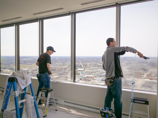 Clearview tinting installers retrofit windows in Toledo's Tower on the Maumee.
